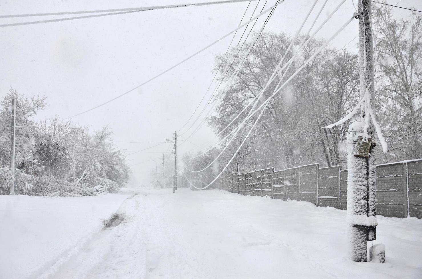 KHARKIV. UKRAINE - APRIL 4, 2017 Unexpected rapid fallout of snow in April on the Kharkov streets photo