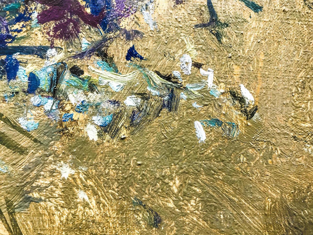 Bright streaks of blue-green paint on an old metal surface with picturesque rust spots and scratches photo
