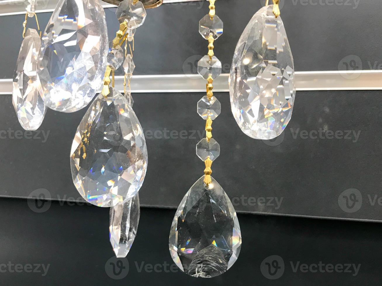 Close up image of crystal on chandelier with bokeh background photo