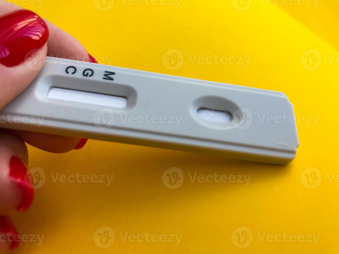 Positive test result by using rapid test for COVID-19, quick fast antibody point of care testing. Lab performing rapid diagnostic test for antibodies to detect presence of antigens COVID-19 disease photo