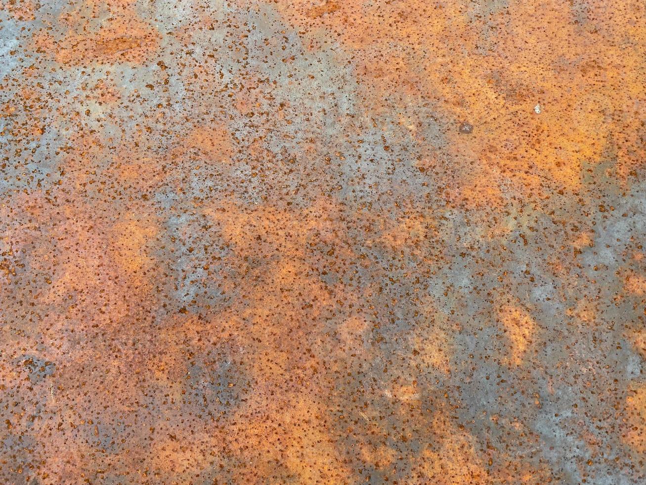 Rusty old iron red scratched metal corrosed sheet surface background, texture industrial in loft style photo