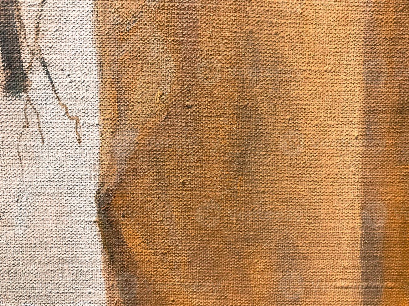 brown, beige, uneven texture. acrylic paint on canvas. palette, paint stains. a mixture of paints with water on a piece of cloth. pussy strokes. the background. volumetric texture on canvas photo