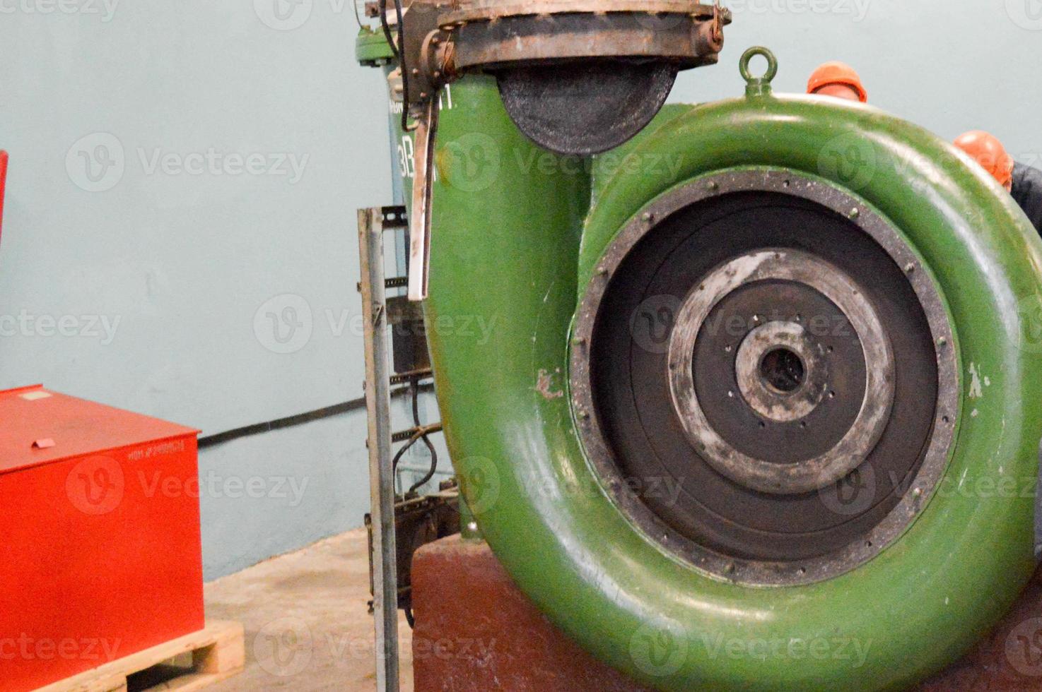 A large iron metal circular impeller of a compressor, an industrial powerful pump for pumping liquid or gas. Spare catch for an oil refinery, petrochemical plant photo