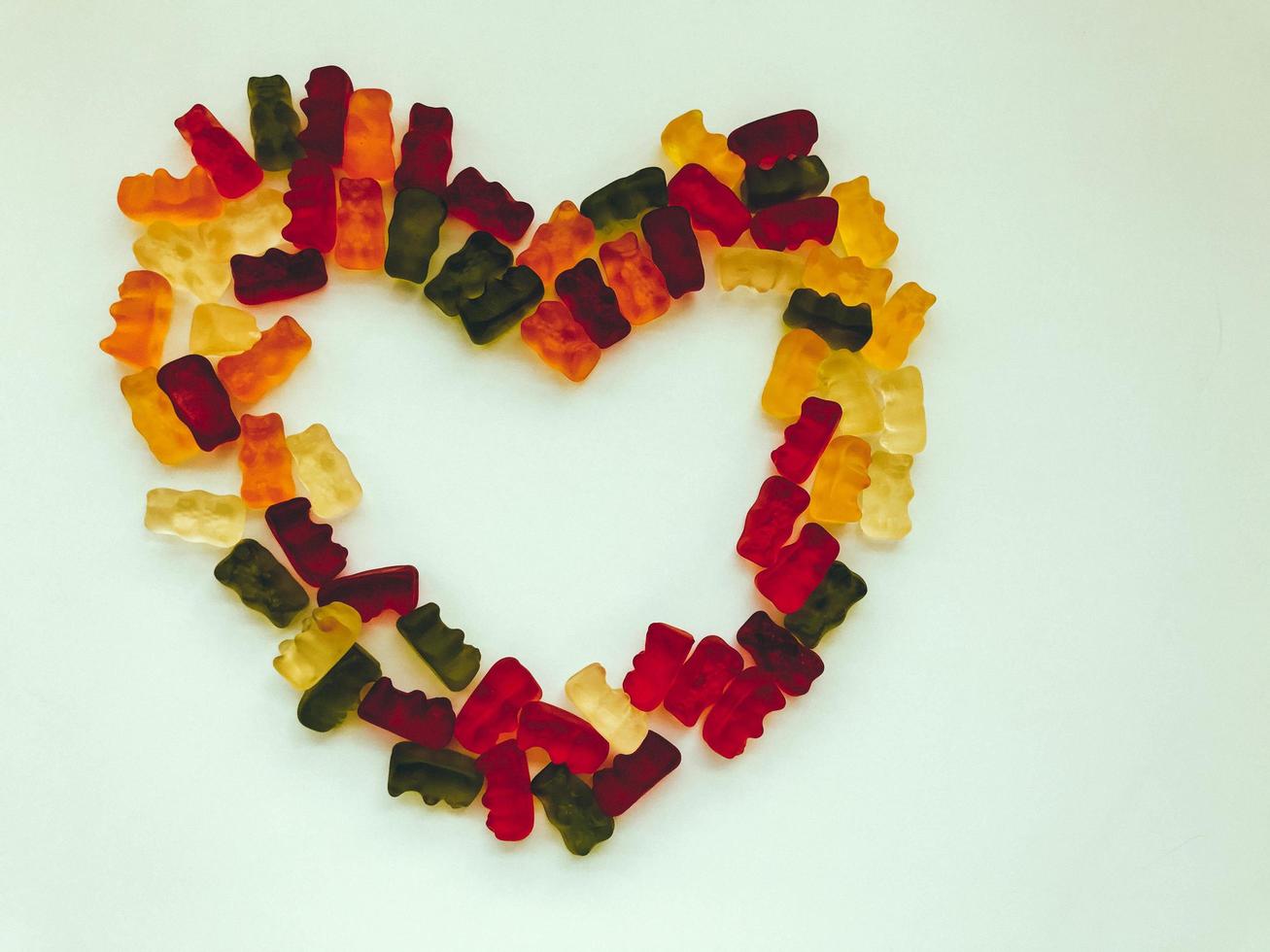 heart made of colored marmalade. love and happiness. marriage and family. a symbol of peace and love made of colored and delicious sweets. family life, love and joy photo