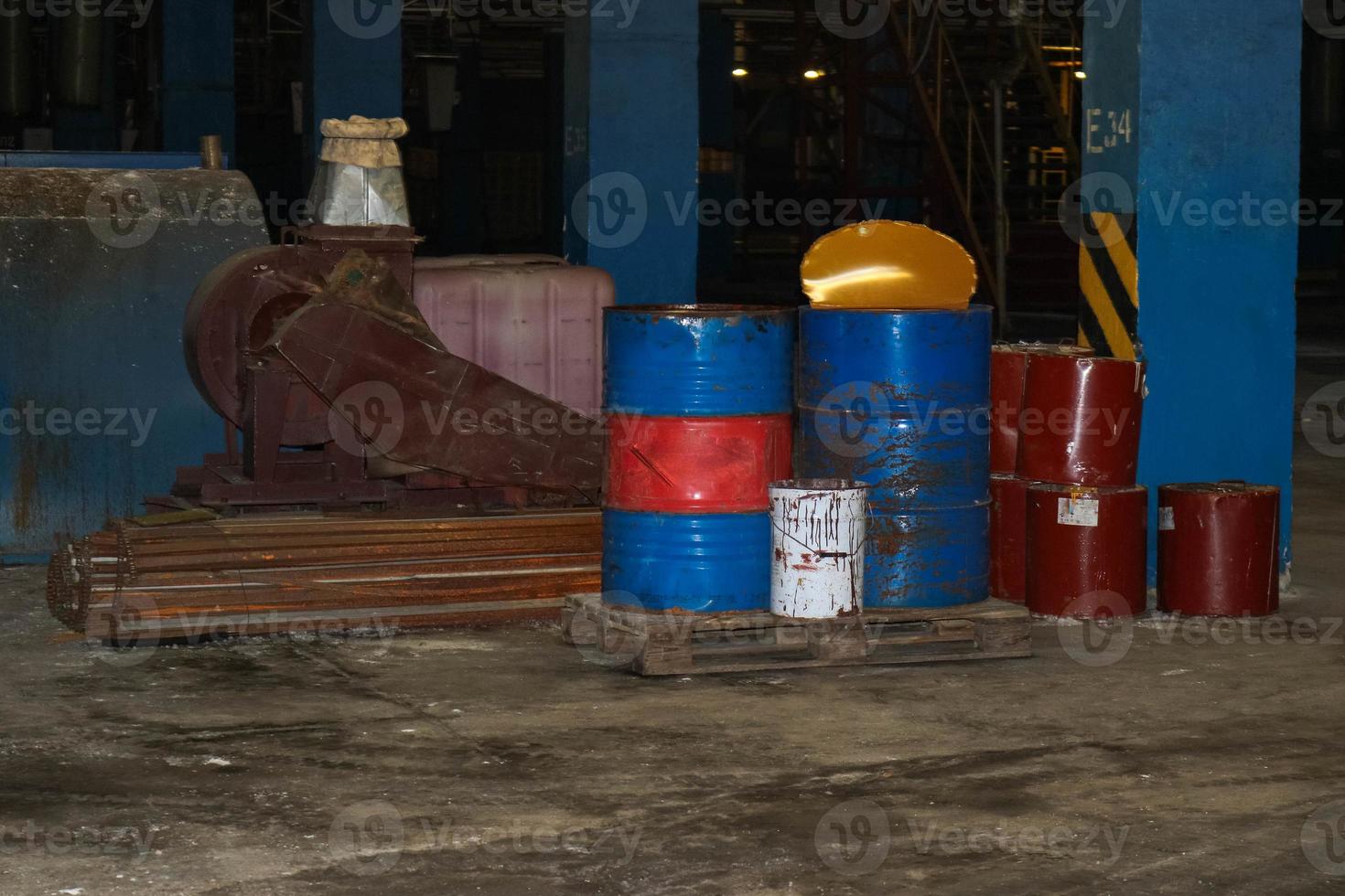 Barrels of oil and fuel, lubricating materials in a dark warehouse at the industrial refinery chemical petrochemical photo