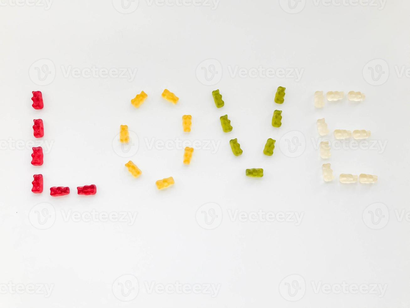 word love made from marmalade. delicious, mouth-watering sweets in the form of letters. creative letters, made of sweets and sweets. bright treat, creativity, high-calorie dessert photo