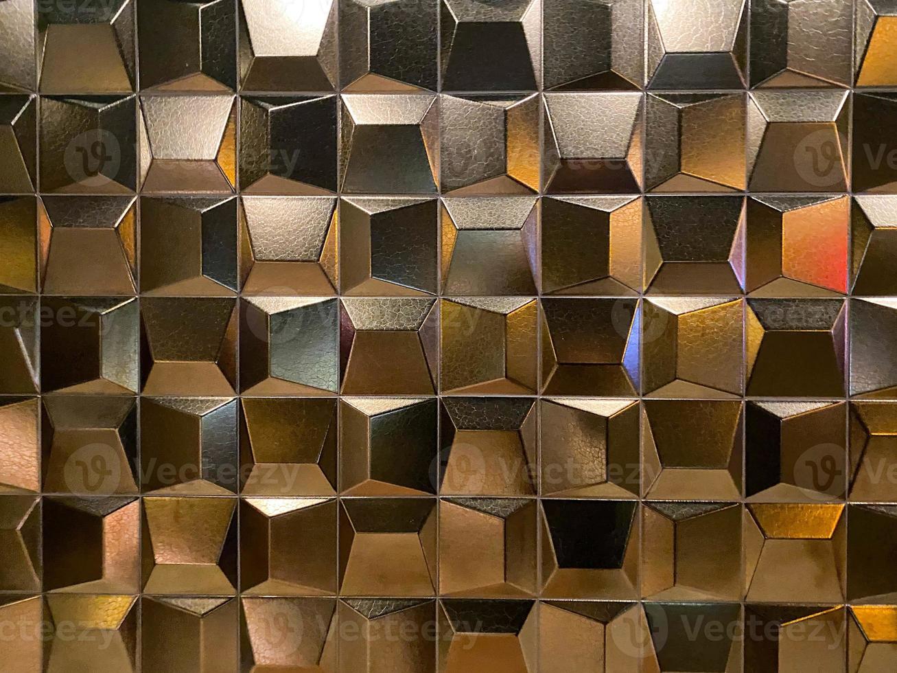 Beautiful golden carved convex shiny squares. Background, texture photo