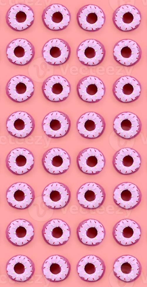 Many small plastic donuts lies on a pastel colorful background. Flat lay minimal pattern. Top view photo
