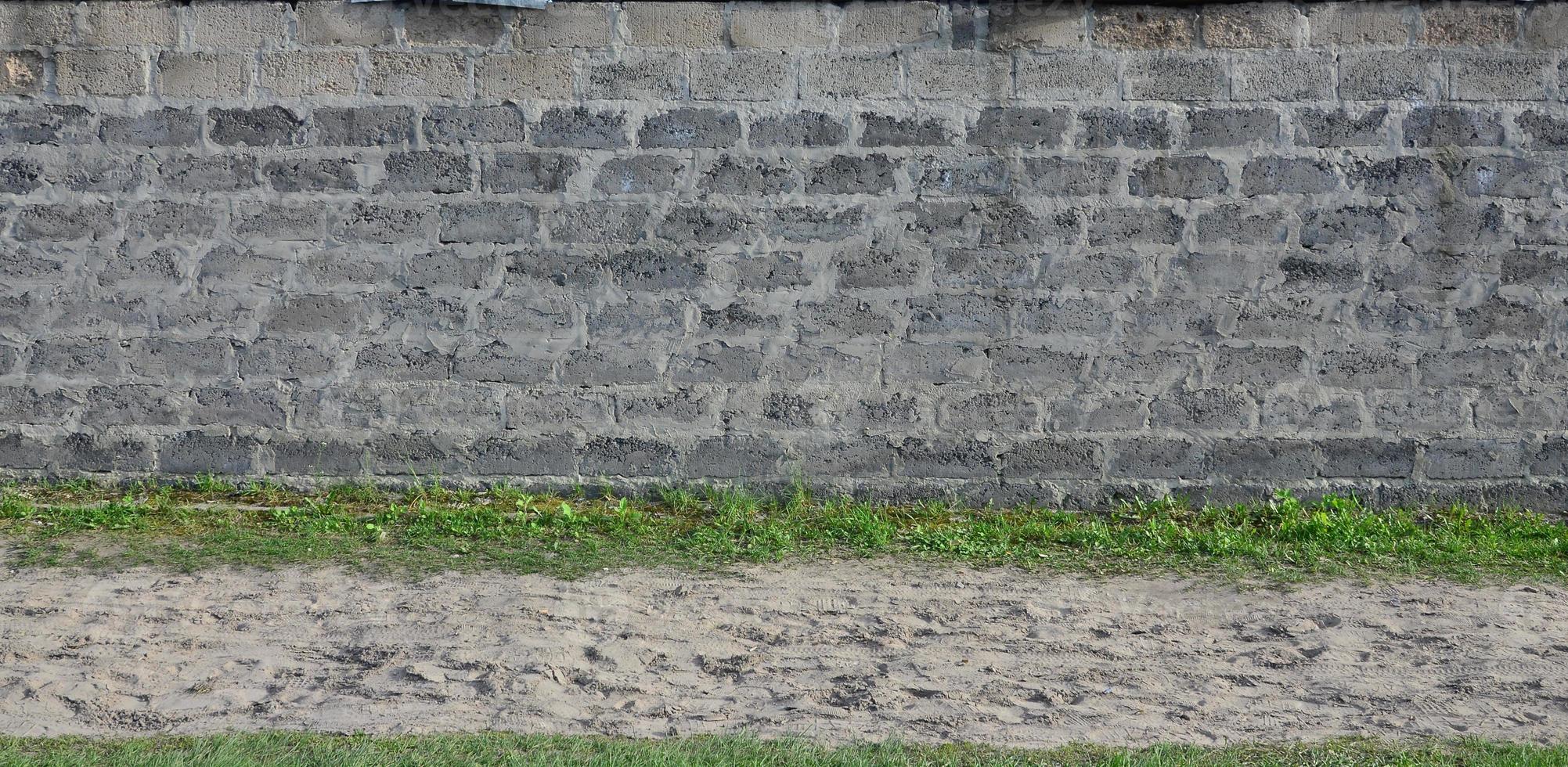 textura de pared de bloque gris desgastada y manchada foto