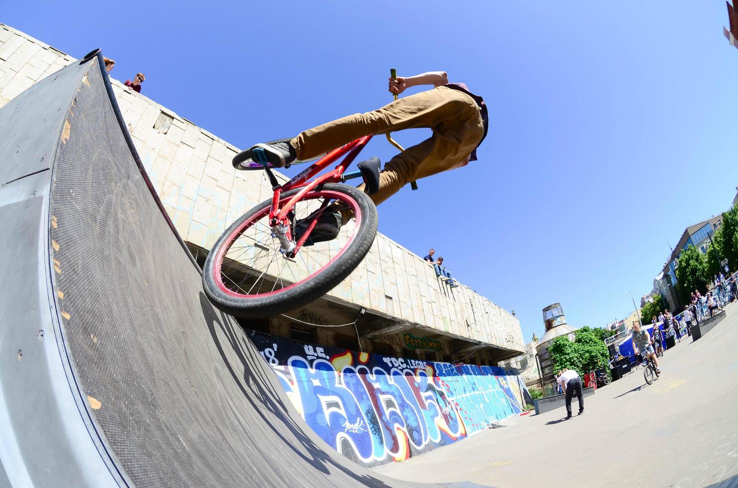 KHARKIV, UKRAINE - 27 MAY, 2018 Freestyle BMX riders in a skatepark during the annual festival of street cultures photo