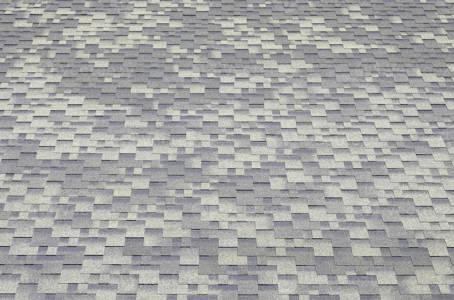 Background mosaic texture of flat roof tiles with bituminous coating photo