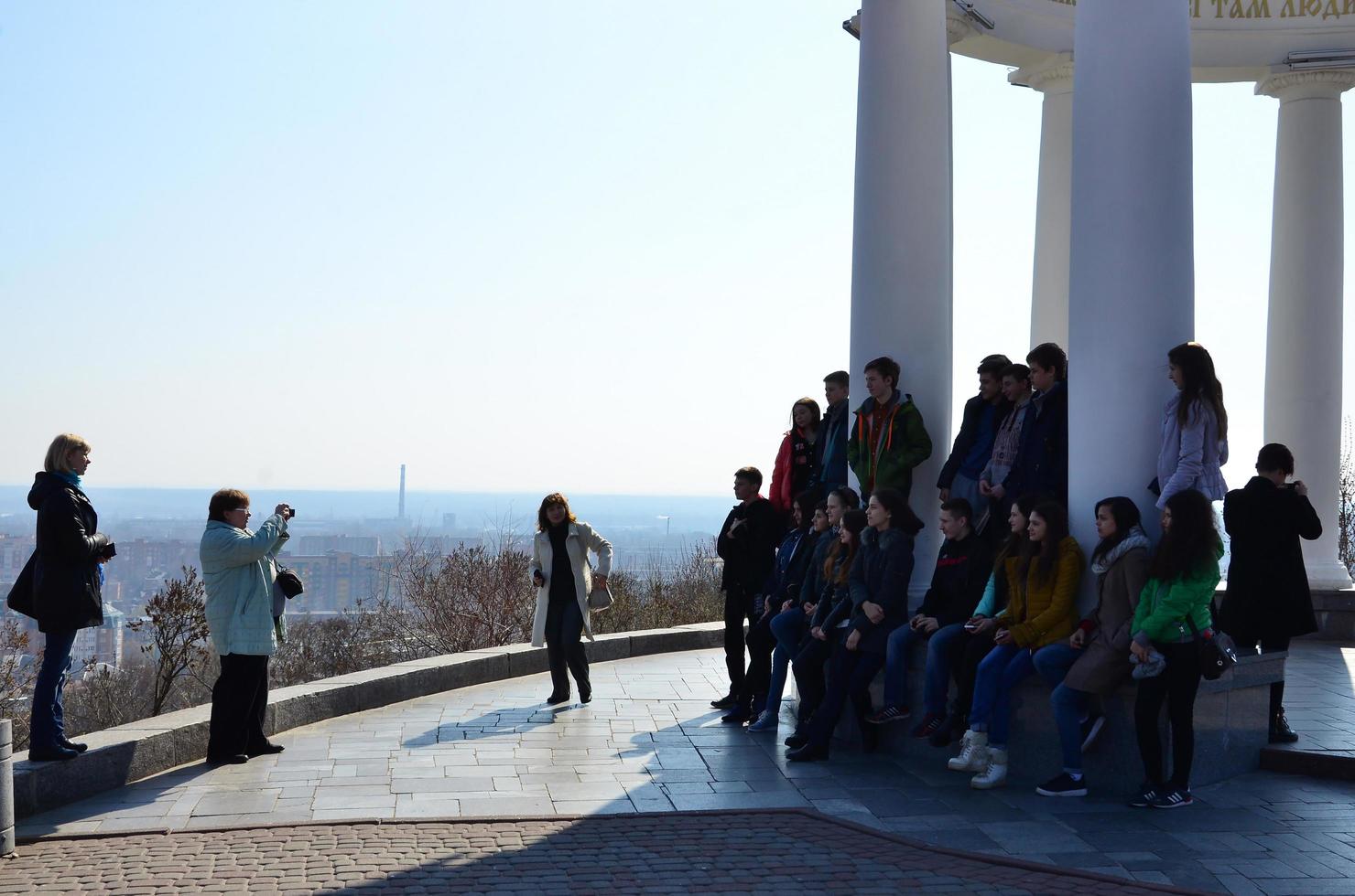 POLTAVA. UKRAINE - MAY 4, 2017 The guide makes a photo to his group of schoolchildren