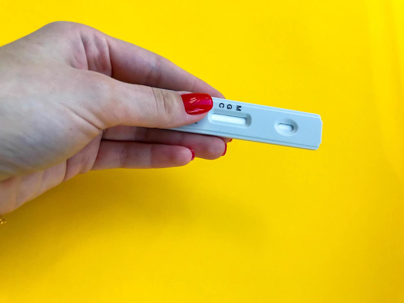 Coronavirus COVID-19 quick Rapid Diagnostic Test RDT,medical worker place collected patient finger prick blood sample specimen on cassette,fast point of care serological diagnostic testing procedure photo