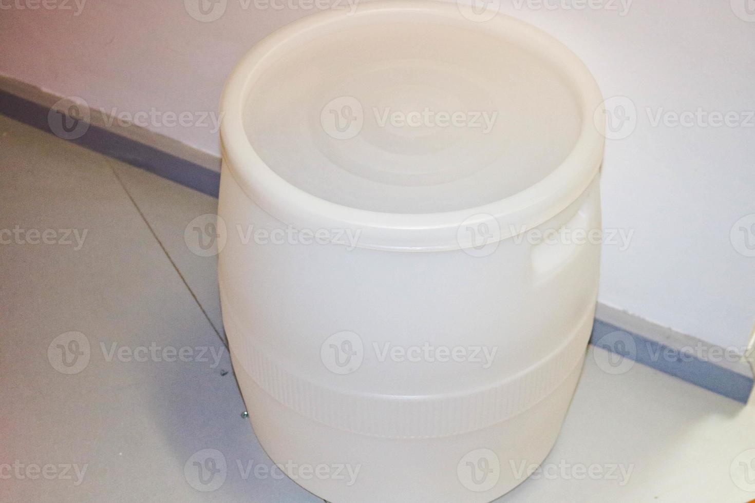 Large plastic white barrel of high-pressure polyethylene. Plastic production photo