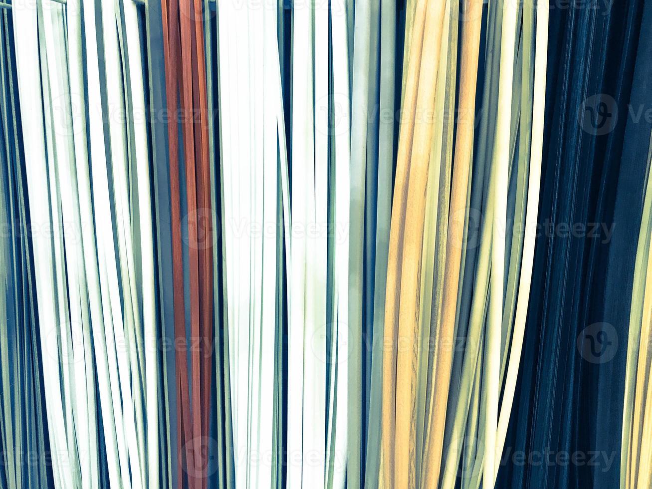 The texture of the plastic building interior decorative baseboards multi-colored with the color of wood. The background photo