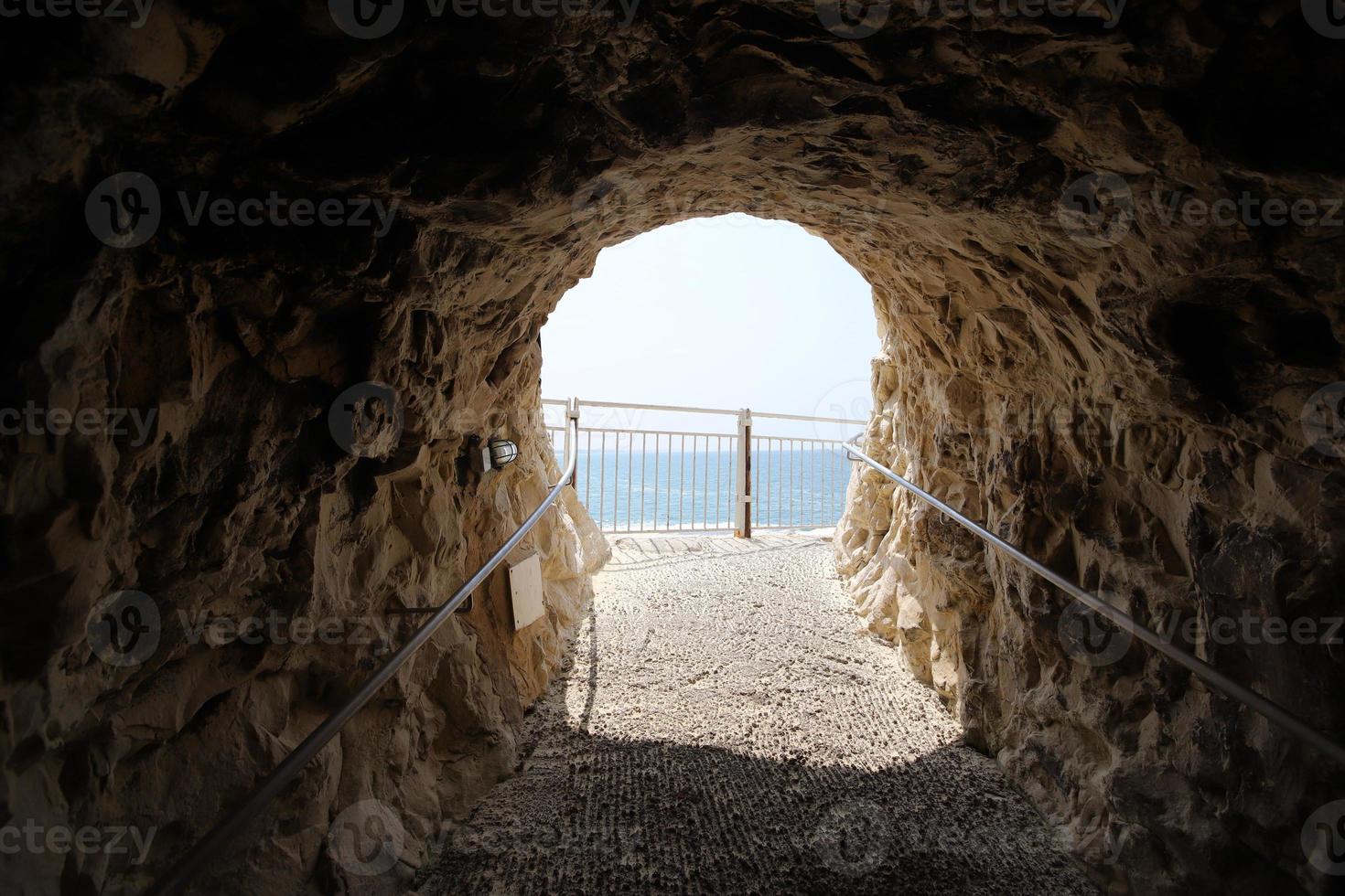 Grottoes in the chalk cliffs on the shores of the Mediterranean Sea. photo