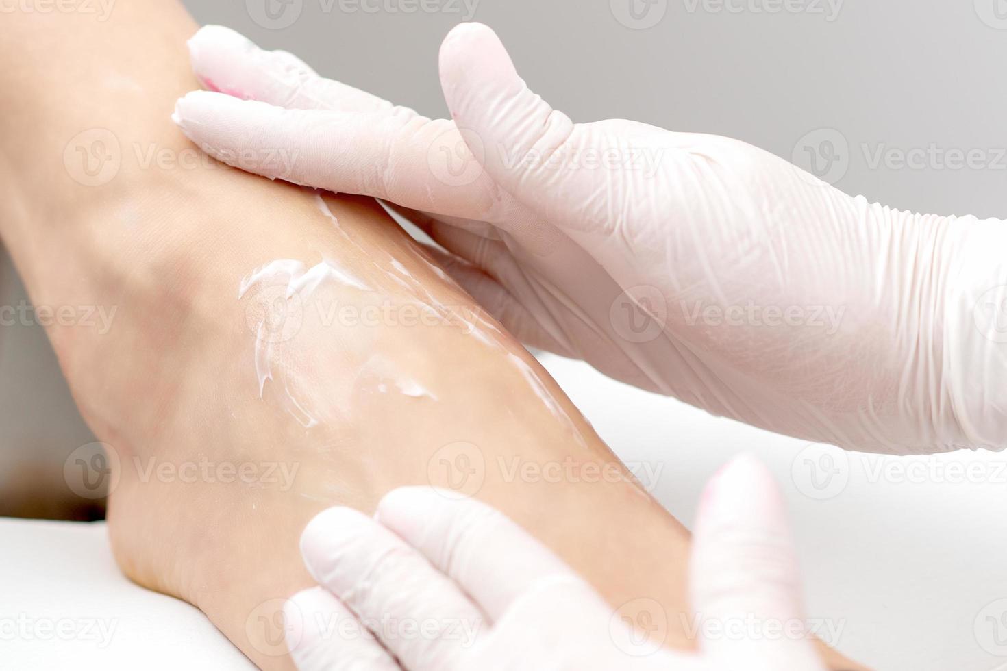 Human hands doing foot massage photo