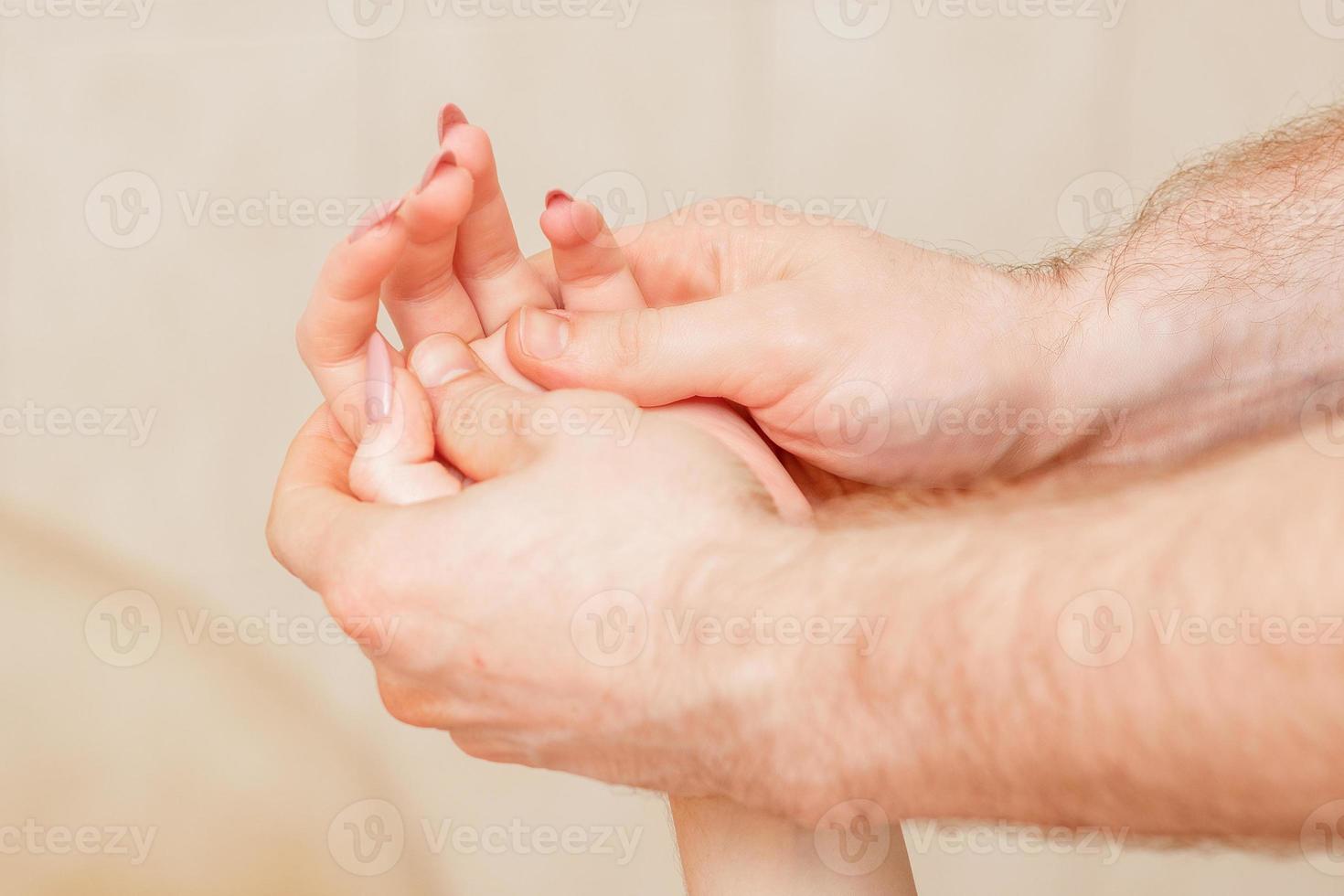 Hand massage of woman. photo
