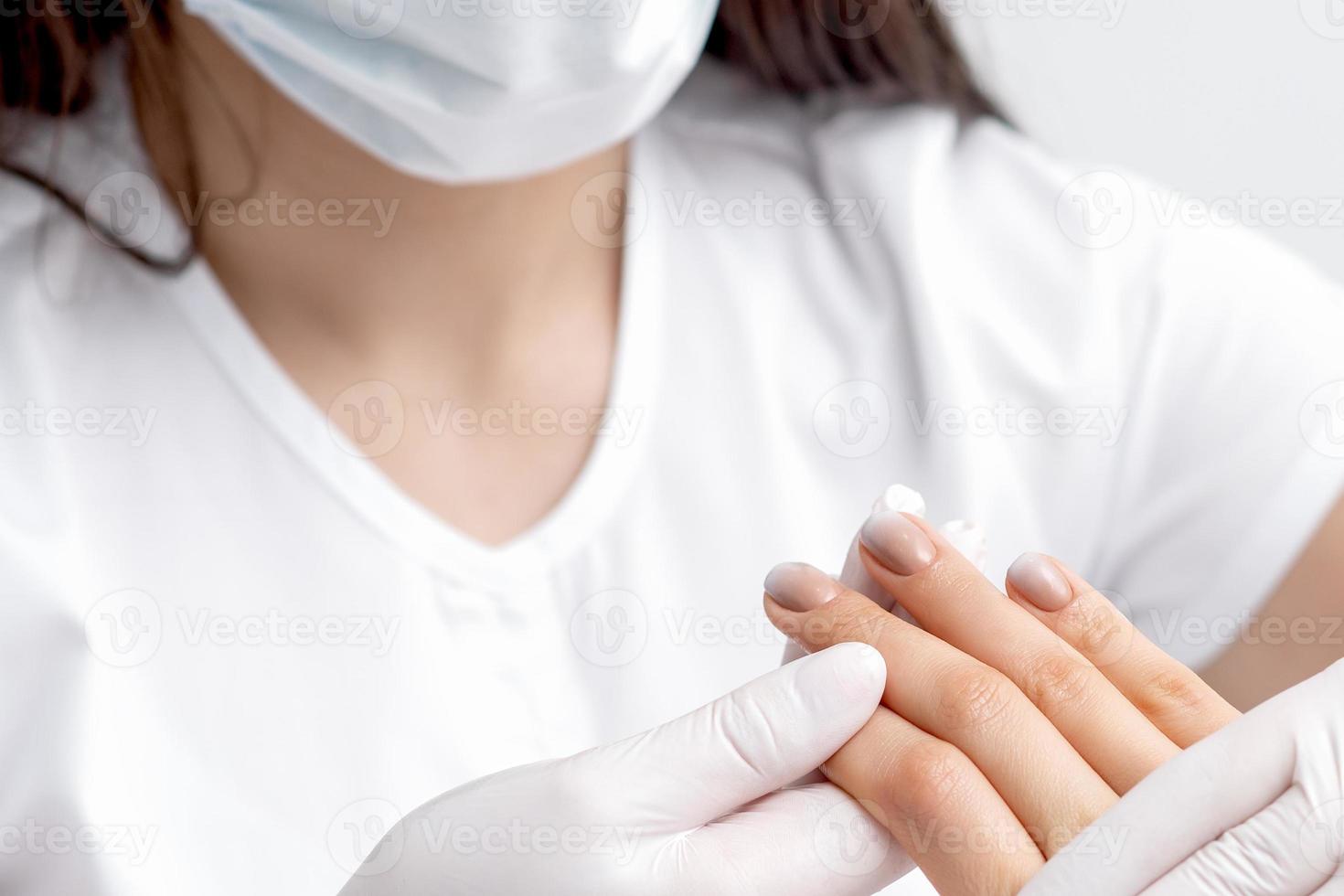 Human hands holding female fingernails photo