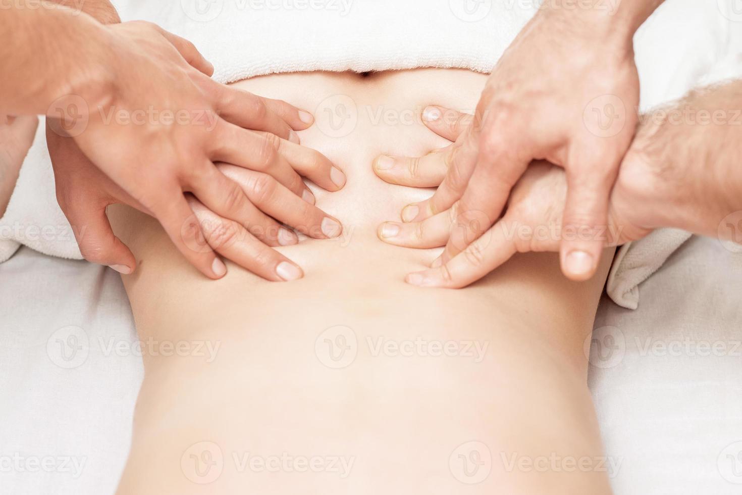 Massage with four hands. photo