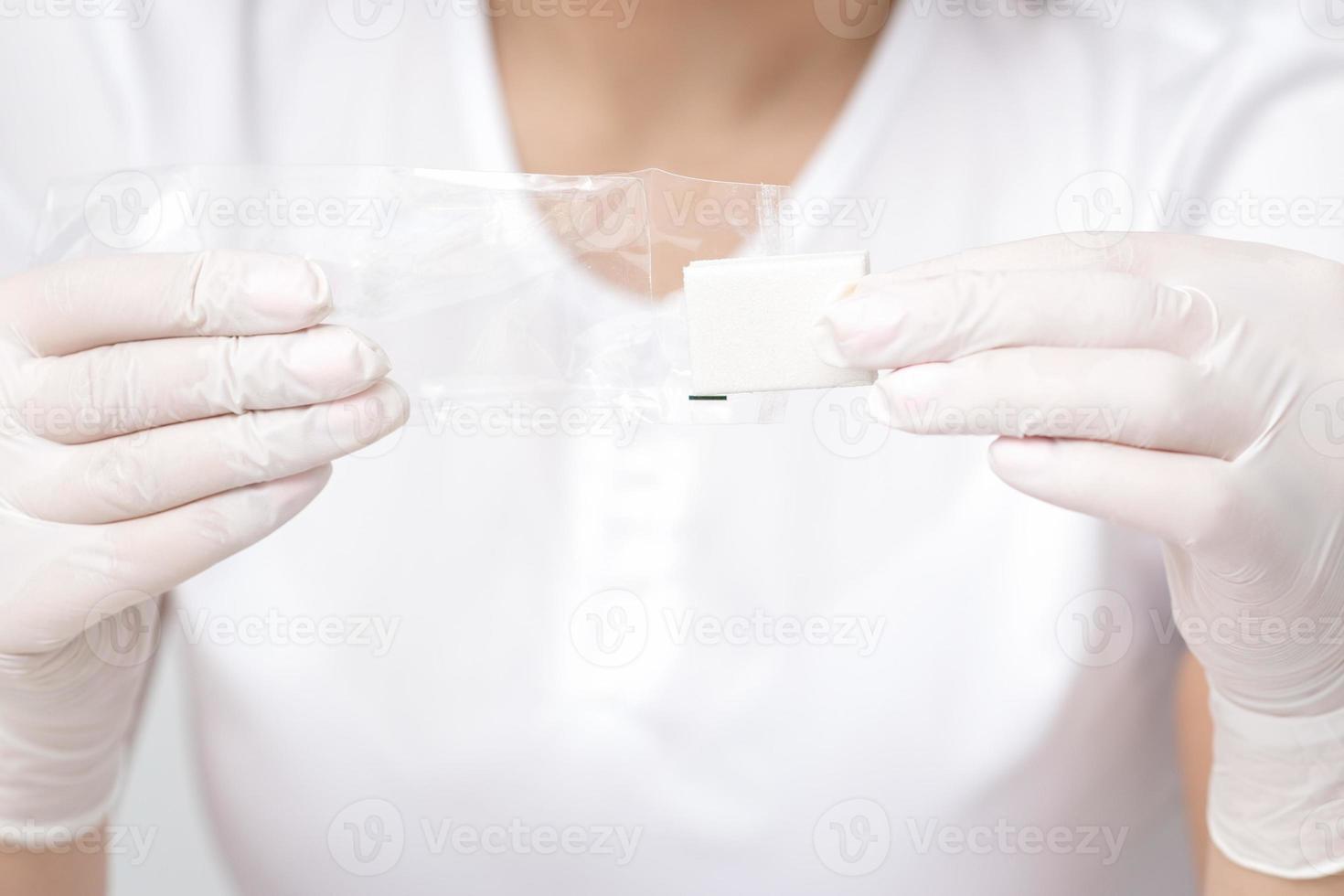 Manicurist holding manicure nail file tool photo