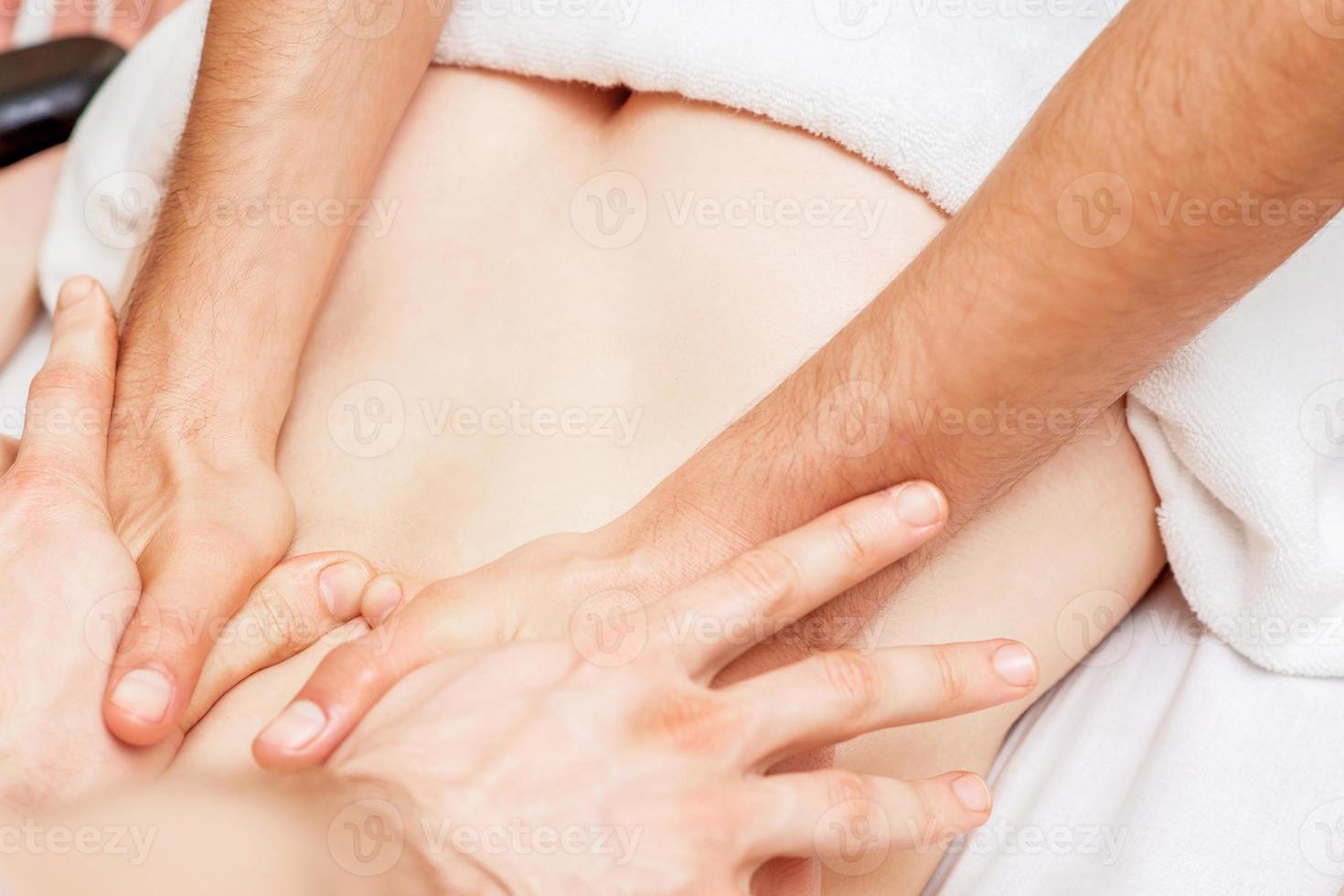 Massage with four hands. photo