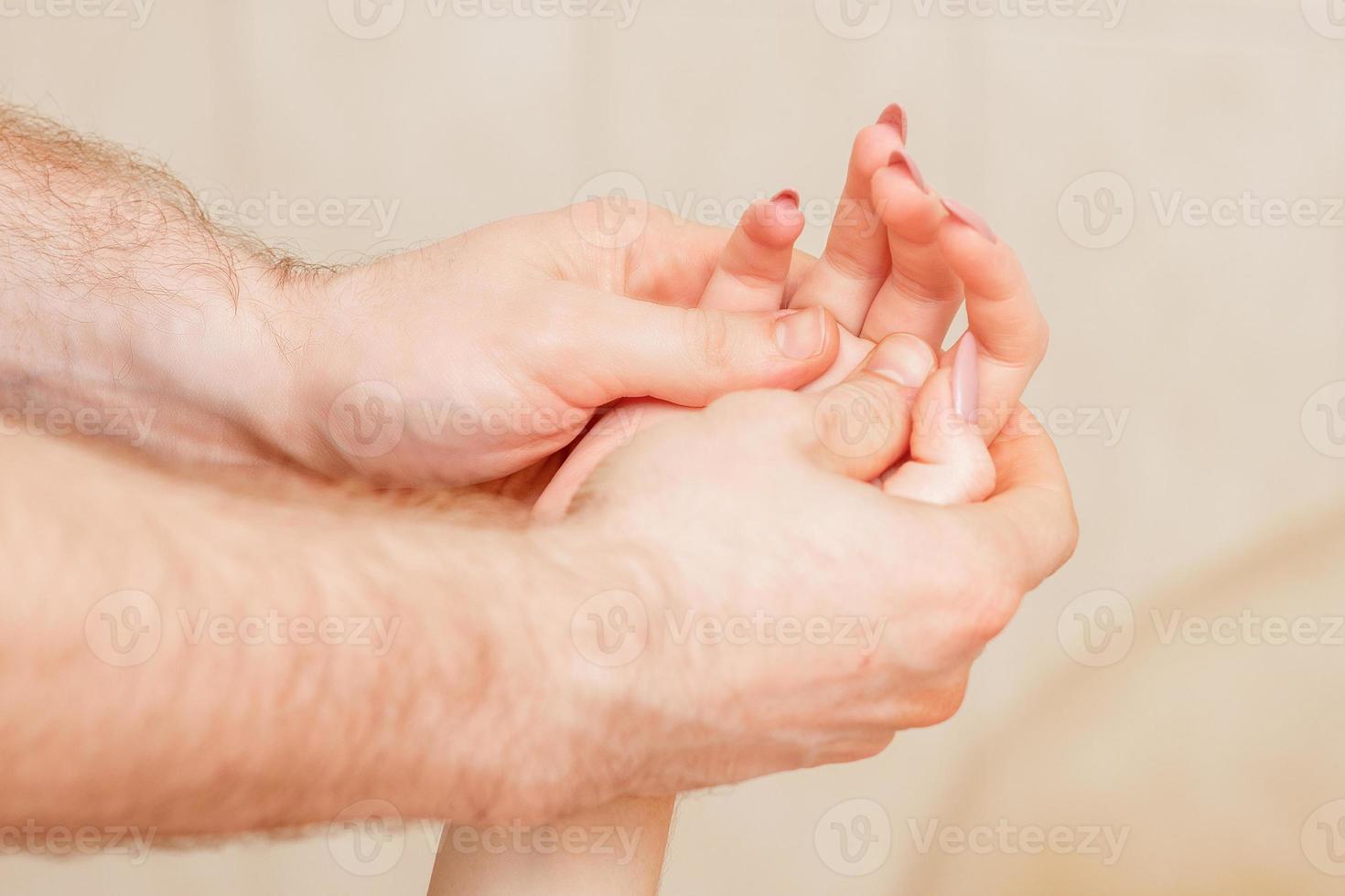 Hand massage of woman. photo