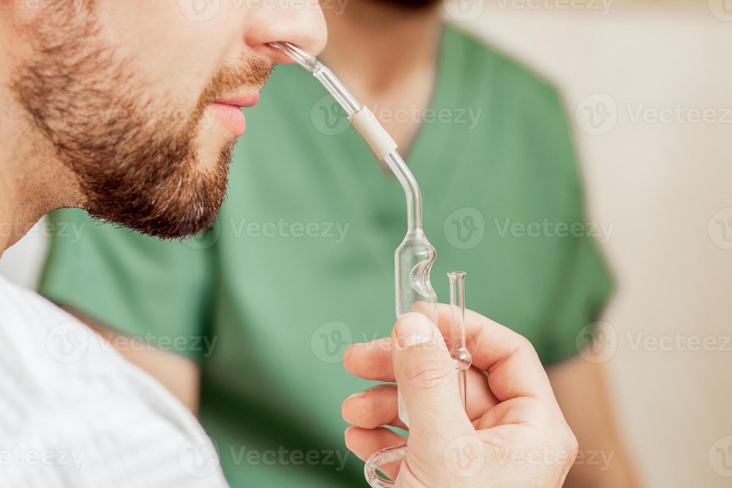 Man receives nasal inhalation. photo