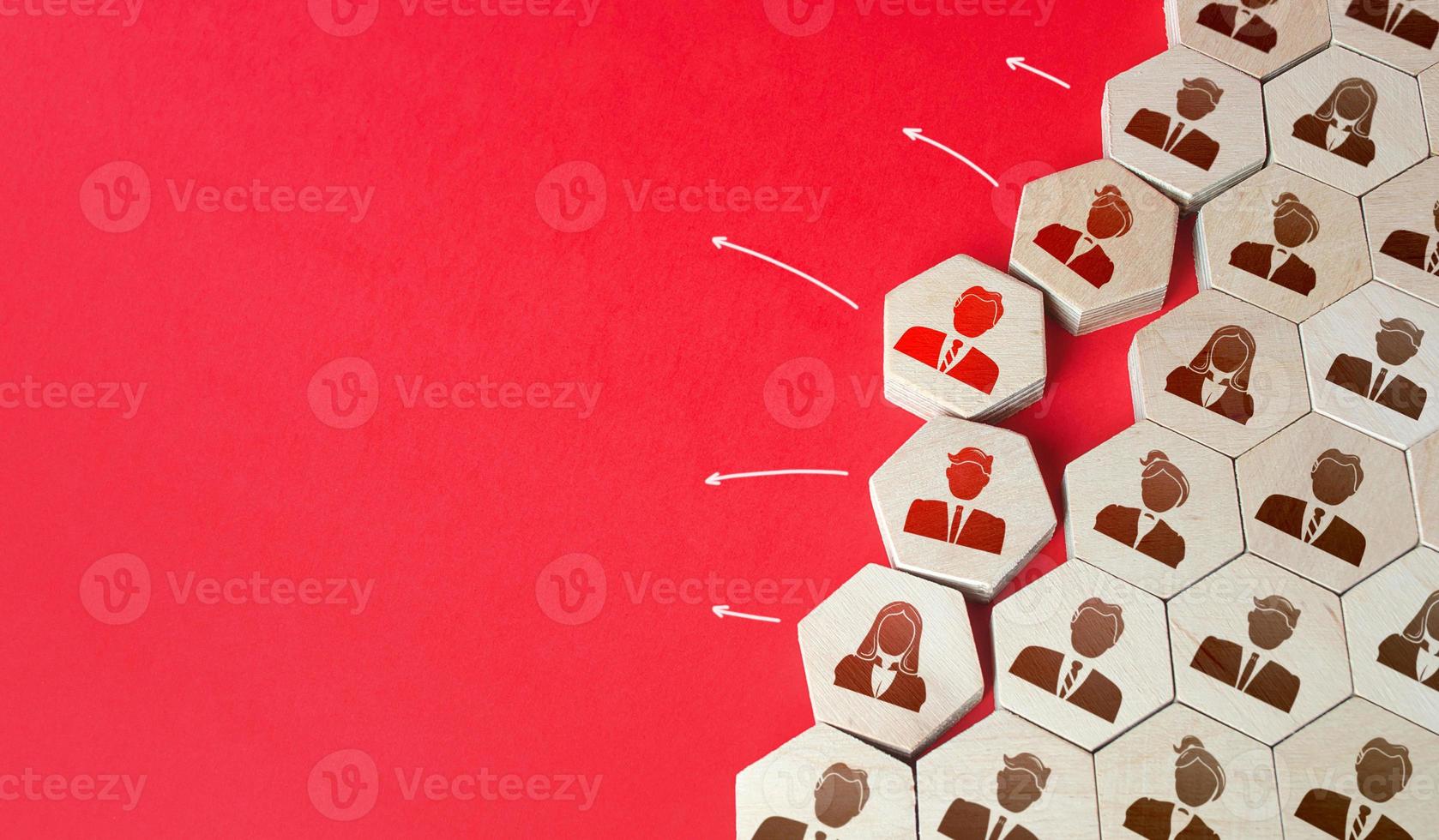 A group of people falls apart. Staff leaving the company. Brain drain. Low loyalty. Poor working conditions. Layoffs and staff optimization. Exit from investment. Loss of valuable personnel. photo