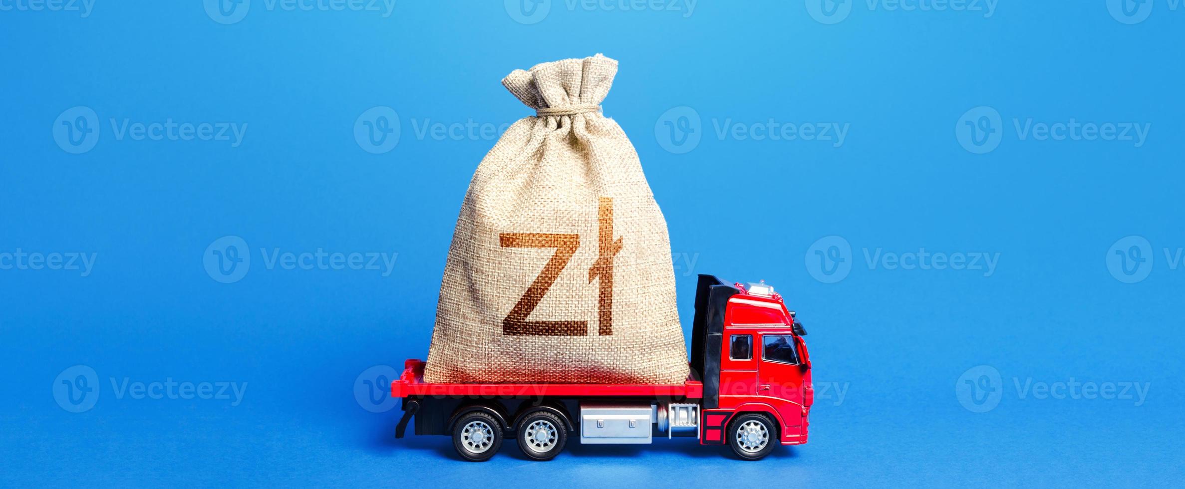 Truck is carrying a big polish zloty money bag. Anti-crisis measures of government. Great investment. Attracting large funds to the economy for subsidies, support and cheap soft loans for businesses. photo