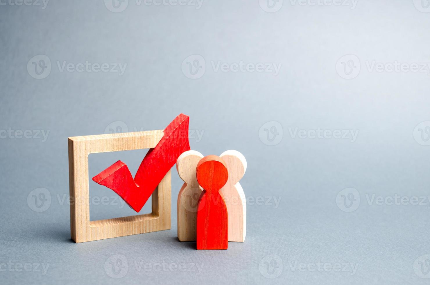 people stand near the checkbox for voting in elections. Lobbying interests, election corruption, voter bribery, and rigging election results. Presidency or parliamentary elections. Selective focus photo