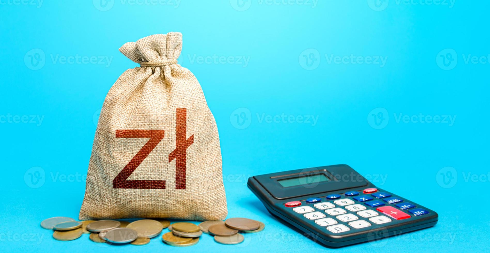 Polish zloty money bag and calculator. Accounting concept. Budgeting. Calculation of damage and insurance payments. Summing up the financial results. Analysis of loan selection. photo