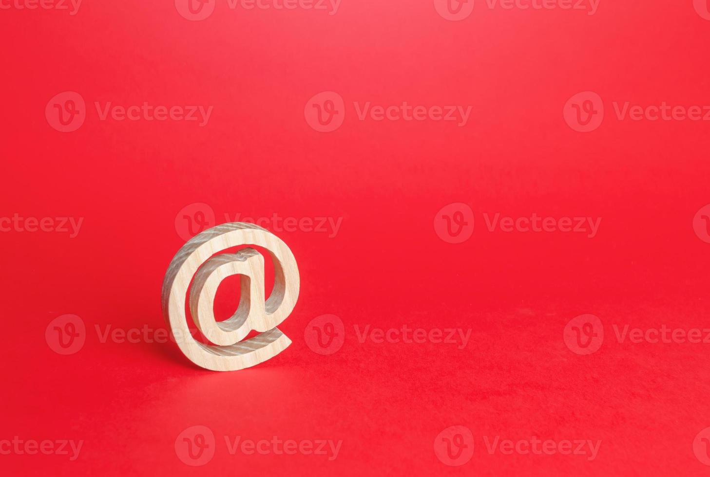 Email figure on blue background. AT commercial symbol. Contacts communication. Business representations on Internet and social media. Concept of e-mail address. Internet provider services photo