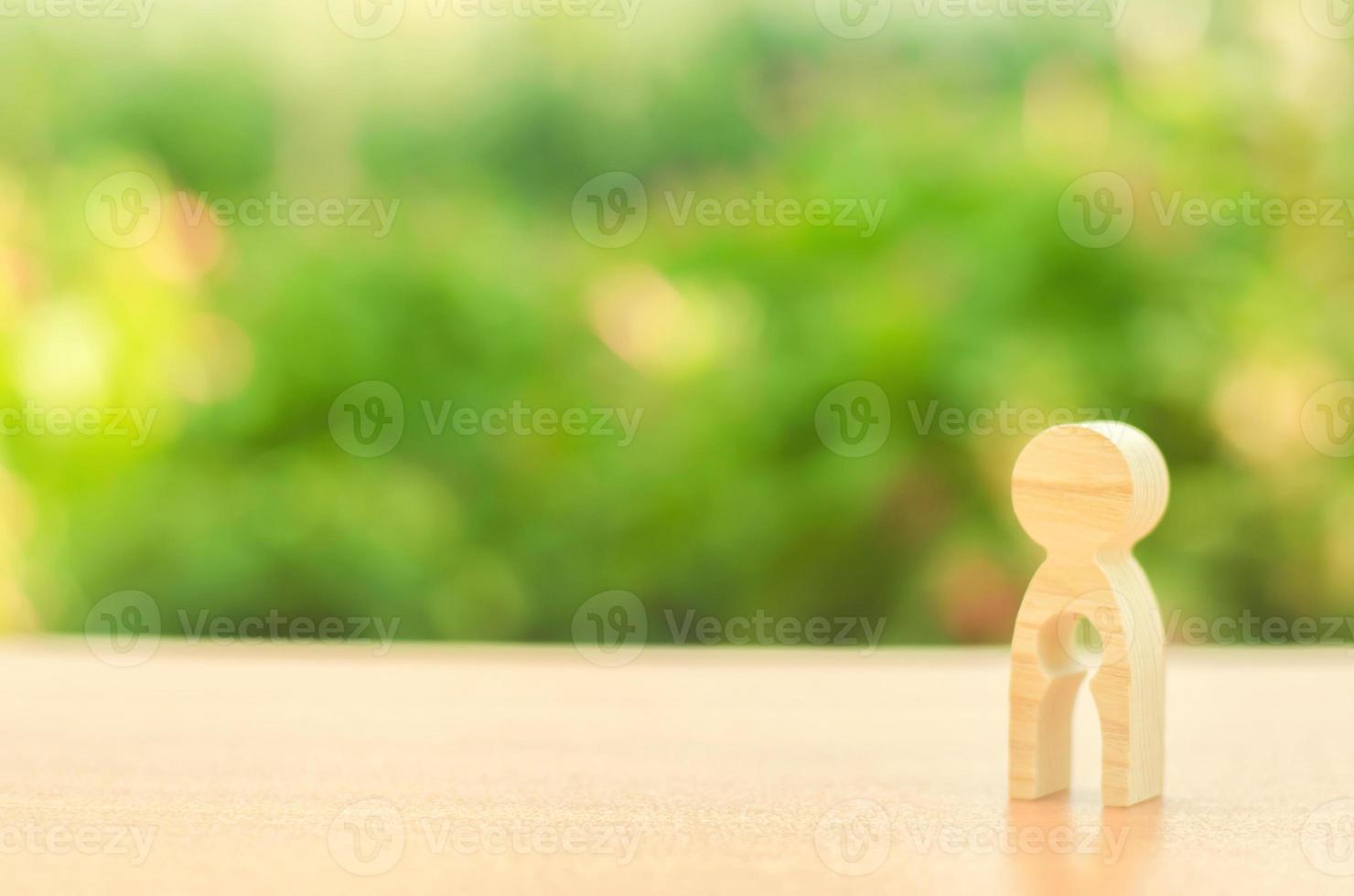 Figurine of a woman with emptiness inside in the form of a child. concept of loss of child, abortion of pregnancy, miscarriage. Female infertility and medical treatment. Demography and family planning photo