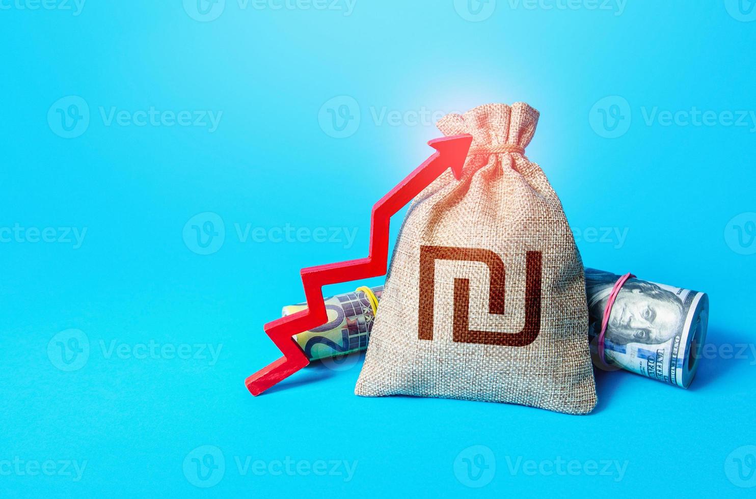 Israeli shekel money bag and red up arrow. Economic growth, GDP. Increase income and business efficiency. Inflation acceleration. Investments. Rise in profits, budget fees. Increase in deposit rate. photo