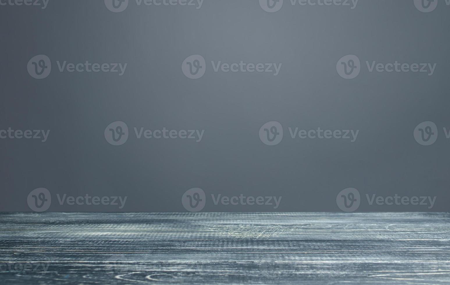 Empty gray background with wooden boards. Slide for presentations and placement of text, products and promotional items. Gray paper with white highlights. Beautiful and sophisticated, minimalism. photo