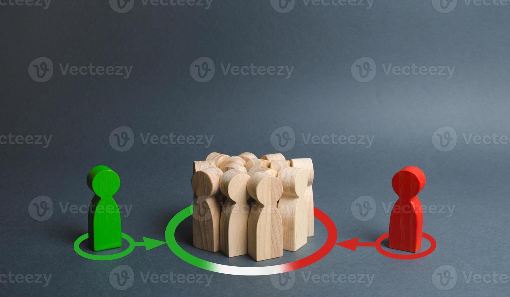 red and green figures of people influence the crowd. Pressure, influence on public opinion, communicating. influence of media oligarchic groups on the opinion of the population. change to their side photo