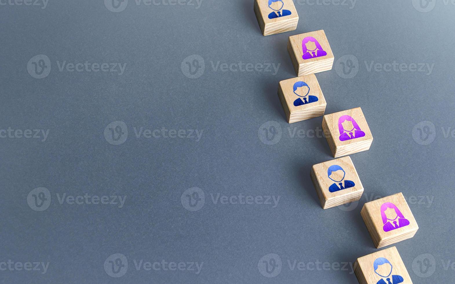 A row of blocks with employees. Recruiting and staffing. Search and recruitment of new employees. Human resources. Find best talent candidate for an open role job. Copy space. photo