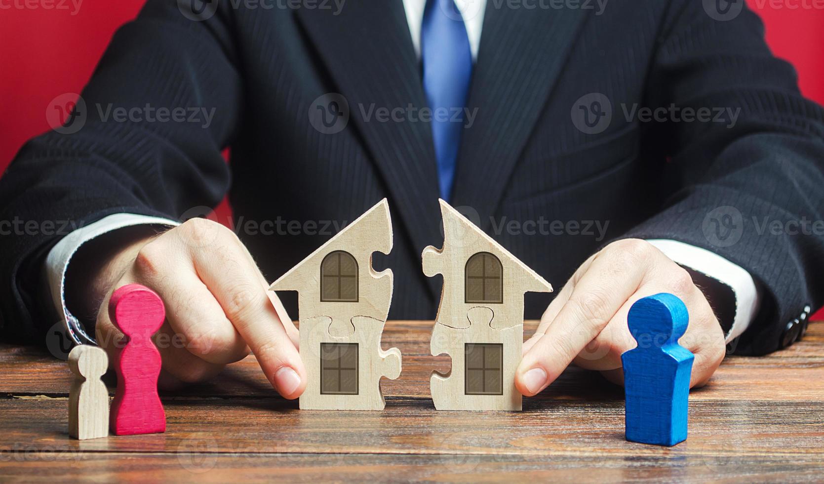 Lawyer controls separation and connection of house between husband and wife. Marriage contract. Former spouses in divorce process. Conflict resolution. Fair division of marital property real estate. photo