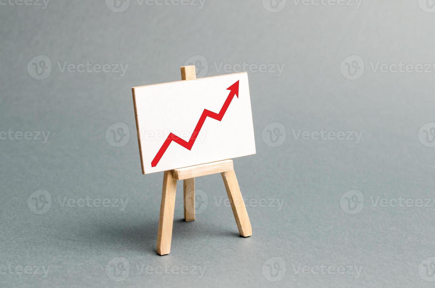Rack with a red arrow up. Business planning and revenue analysis. Indicators of business projects, level of profitability, liquidity. Increase efficiency, productivity. Selective focus photo