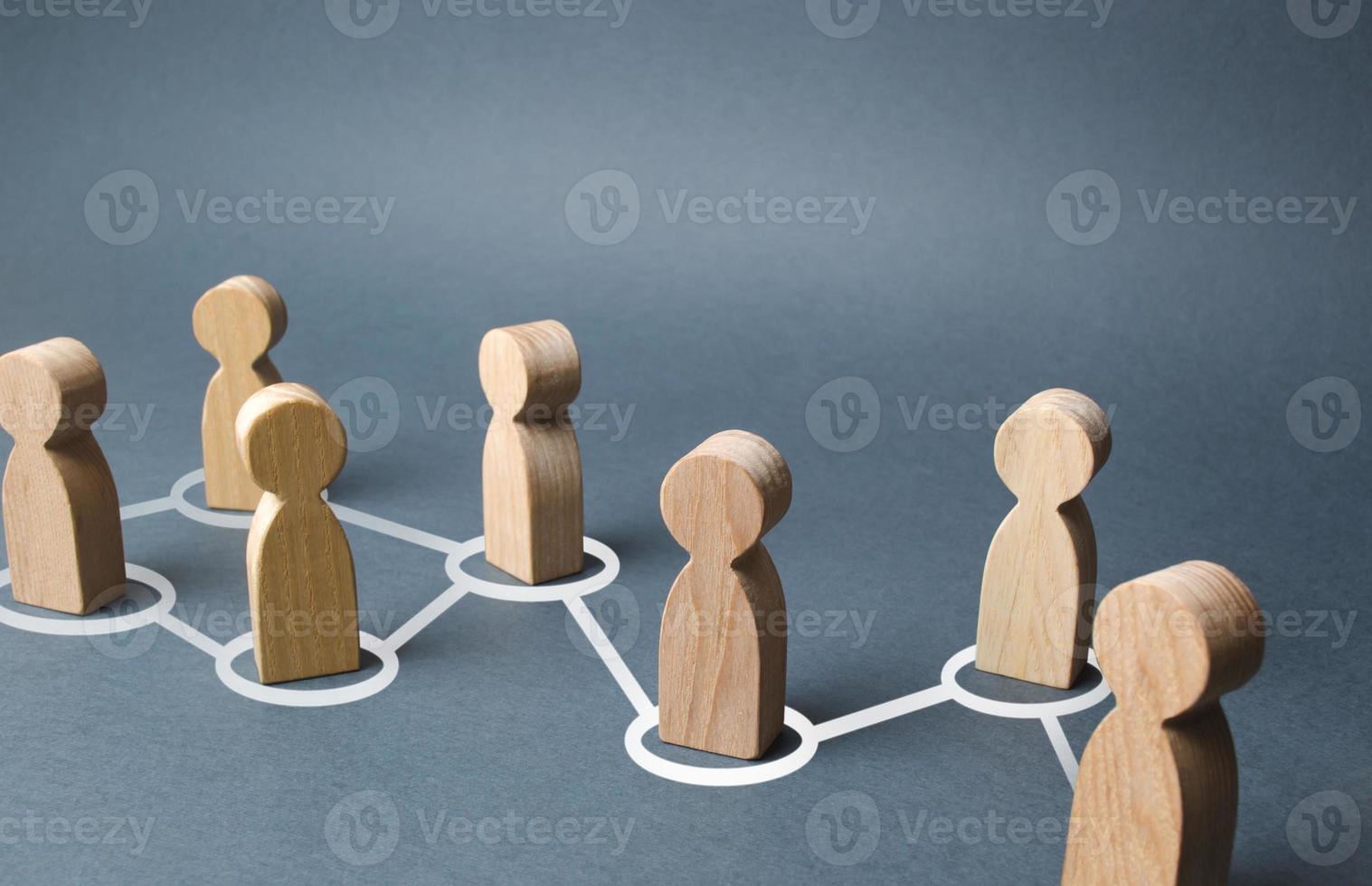 Chain of people figurines connected by white lines. Cooperation and interaction between people and employees. Dissemination of information in society, rumors. Communication. social contacts photo