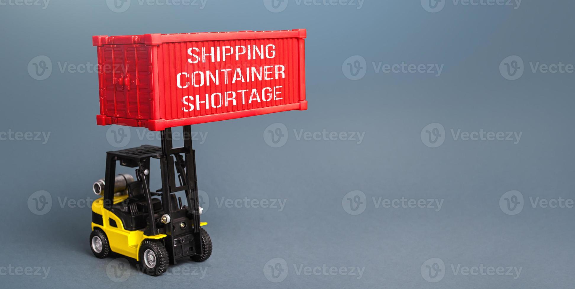 A forklift is loading a container. Container shortage. Inability to export and import products, lack of capacity in the global transport system. World trade imbalance High prices for transportation photo