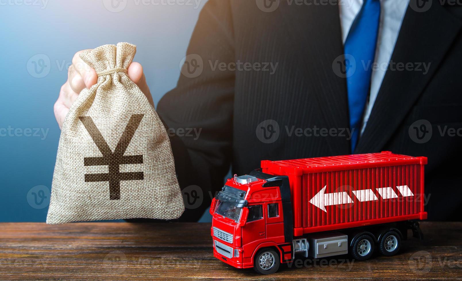 Businessman with chinese yuan or japanese yen money bag and truck. High income of the transport business and the transport of goods. Global containers shortage crisis. Good salaries for drivers. photo