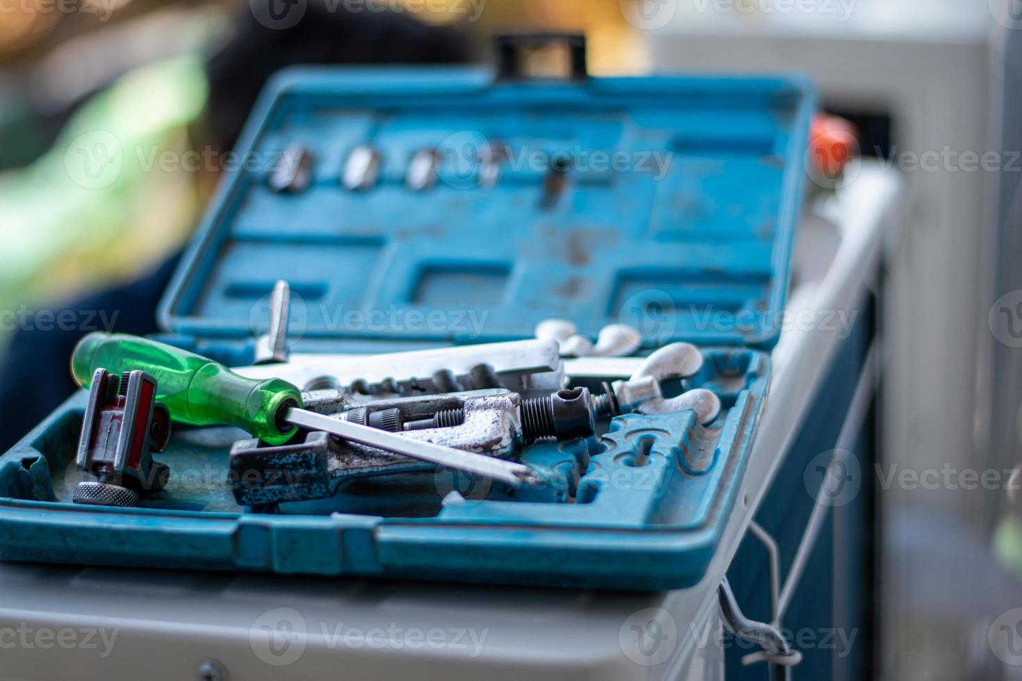 Hand tools or tool boxes to store wrench, pliers, screwdrivers, screws, bolts and more. To do yourself. photo
