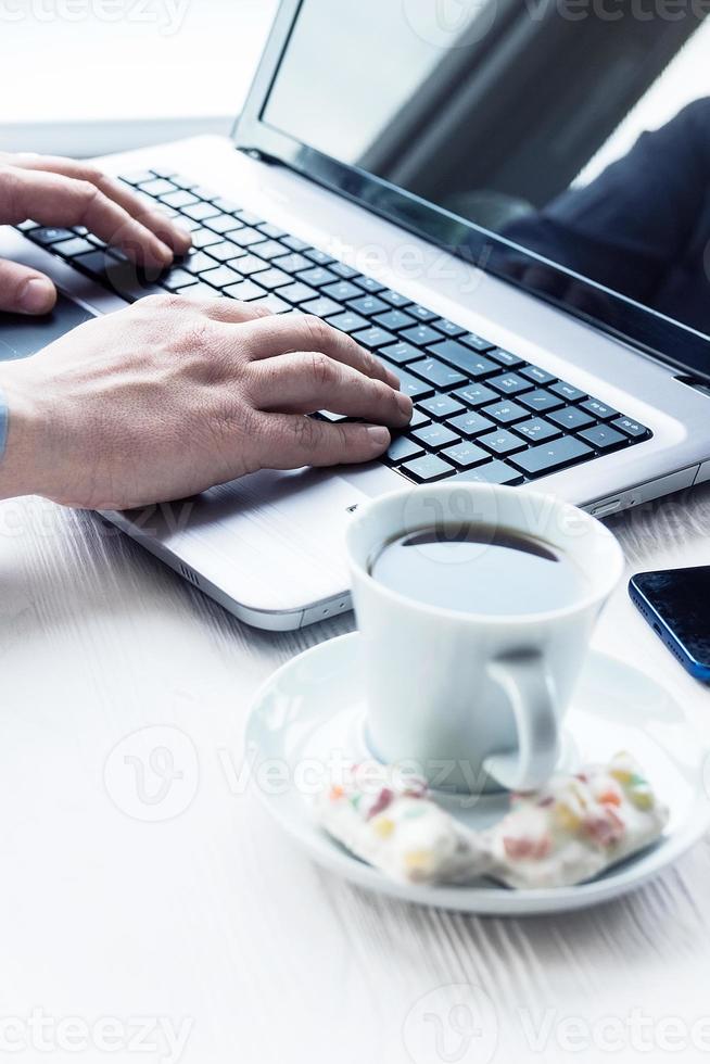 man behind laptop photo