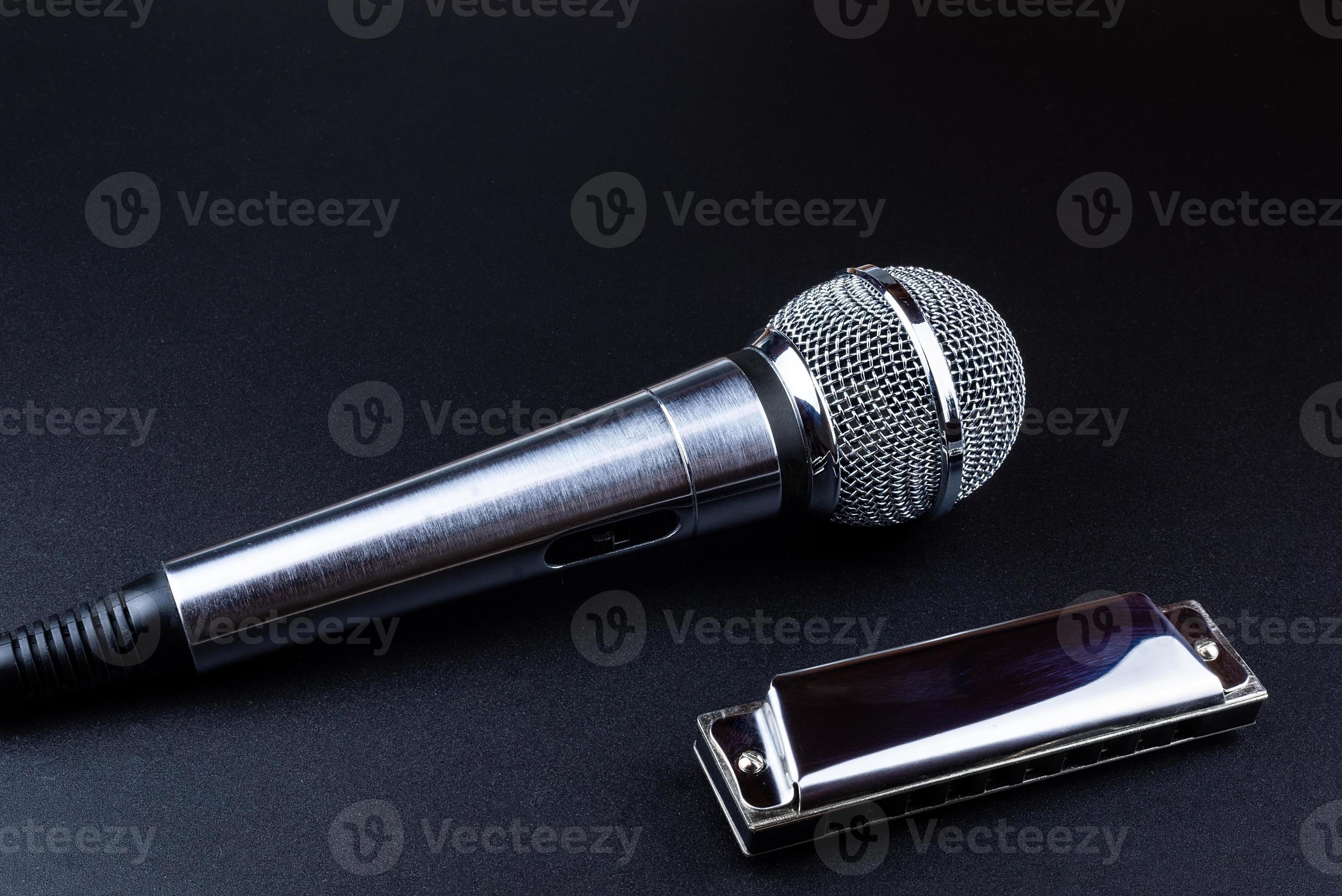 Microphone and harmonica 13620133 Stock Photo at Vecteezy