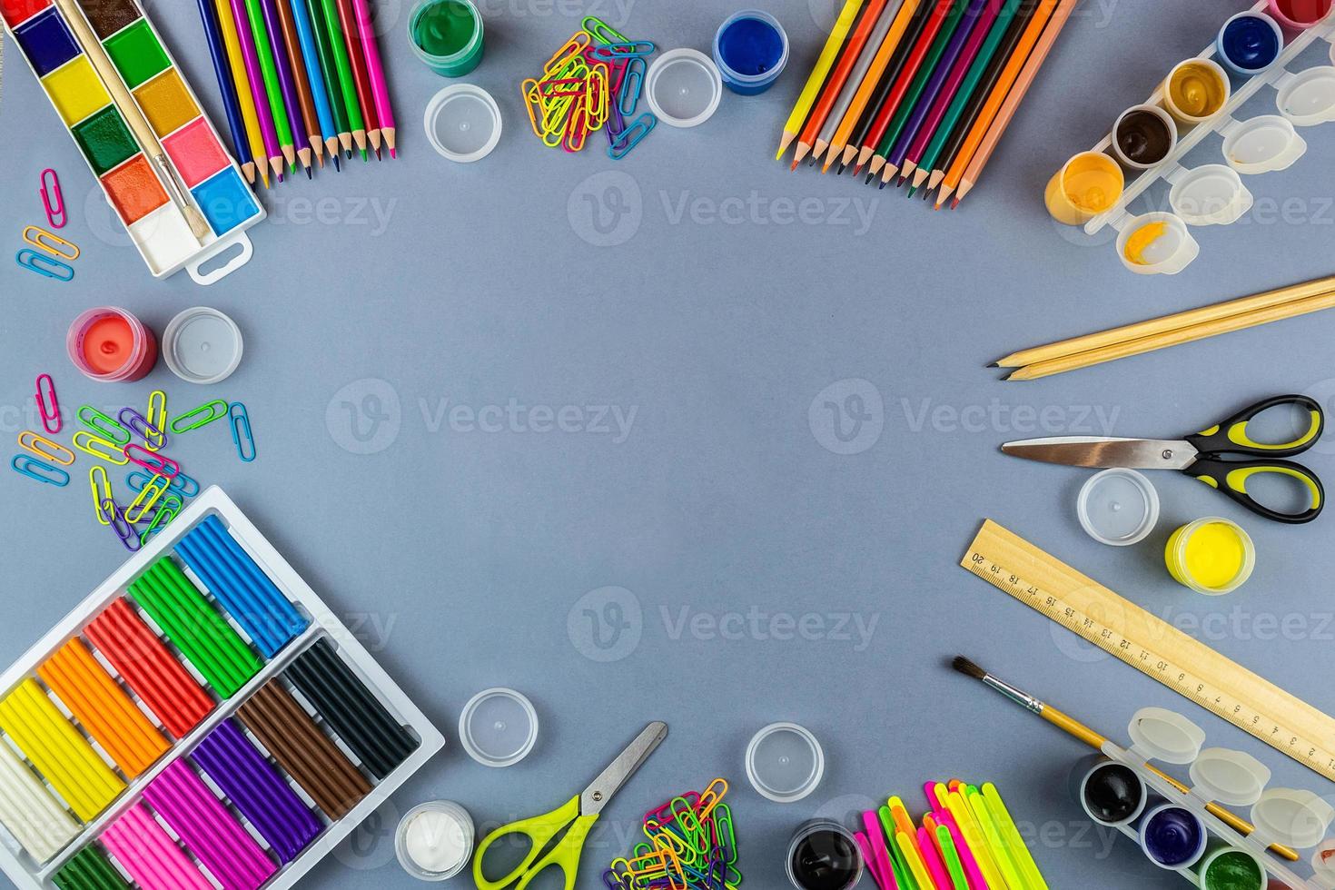 School supplies on a grey background photo