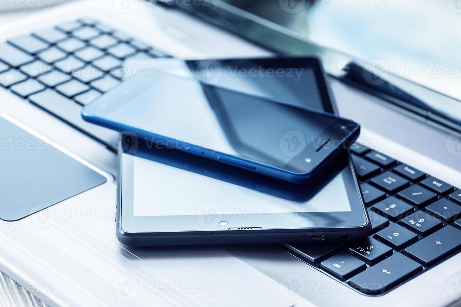 Laptop with tablet and smartphone photo