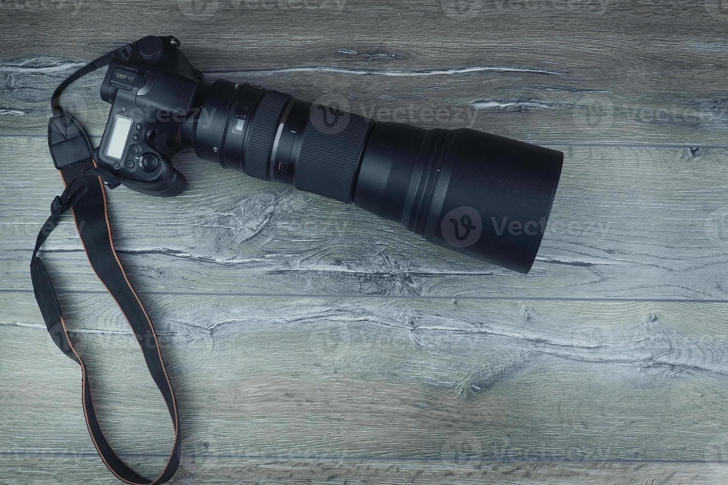 camera on a wooden background photo