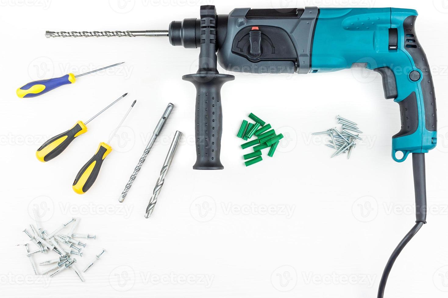 Perforator and screwdriver with screws photo